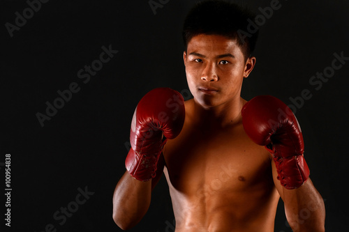 Muay Thai boxing male boxer isolated on black backgrounds