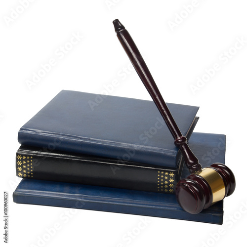Valokuvatapetti Law book with a wooden judges gavel on table in courtroom