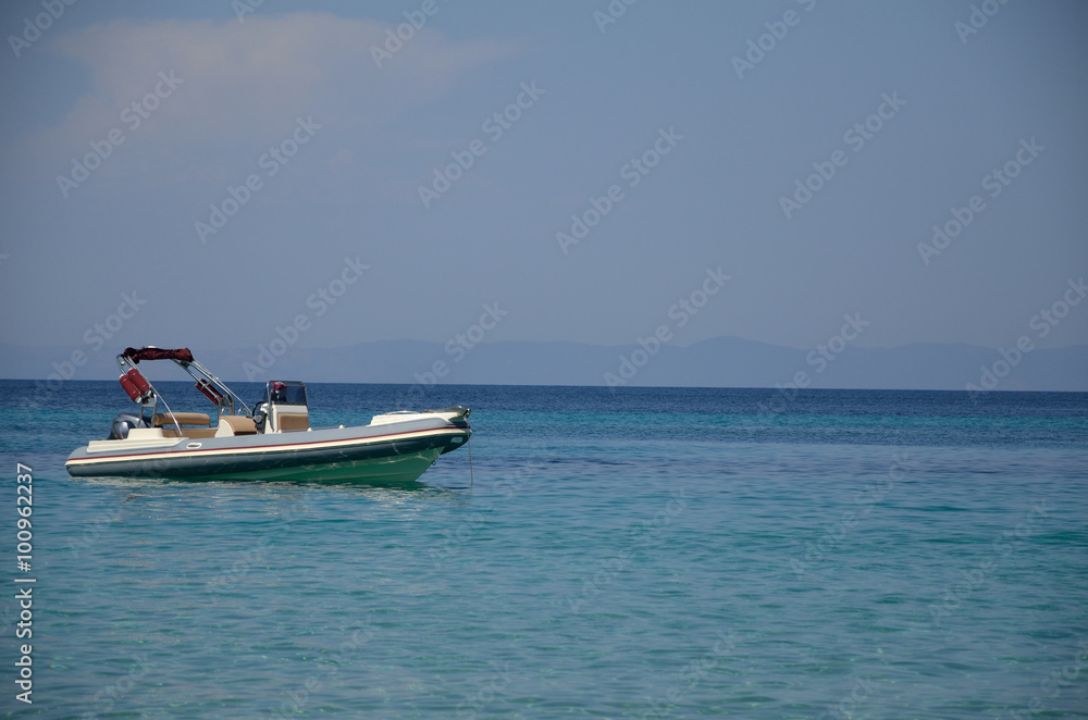 White Powerboat on Turquoise Sea