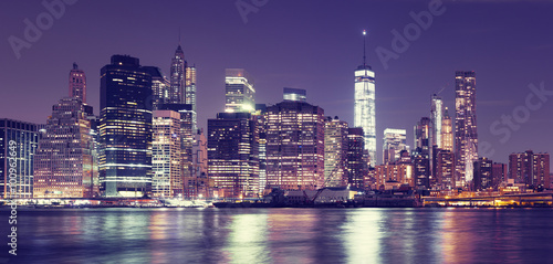 Fototapeta Naklejka Na Ścianę i Meble -  Vintage toned New York City at night panoramic picture, USA.