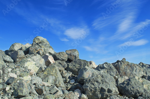 A heap of stones on a background of blue sky © Serg_Zavyalov_photo