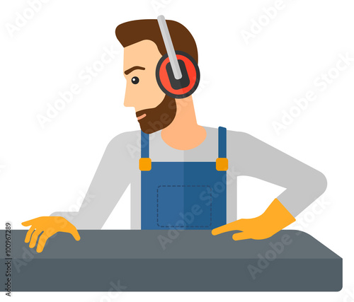 Man working on steel-rolling mill.