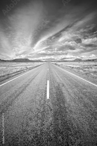 Black and white photo of a country road, USA.