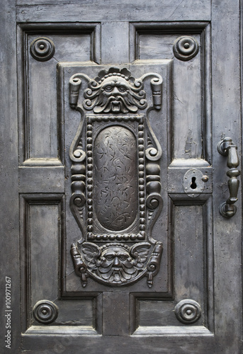 Old carved door in Pisa