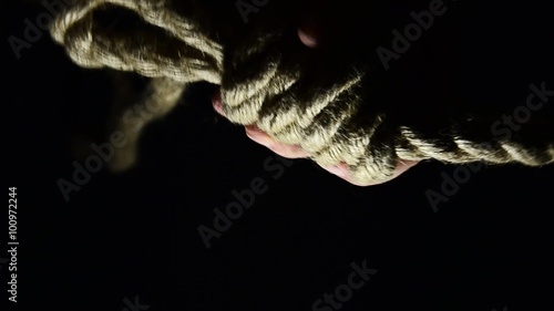 Man tying a noose. suicide, depressed man, gallows noose around his neck