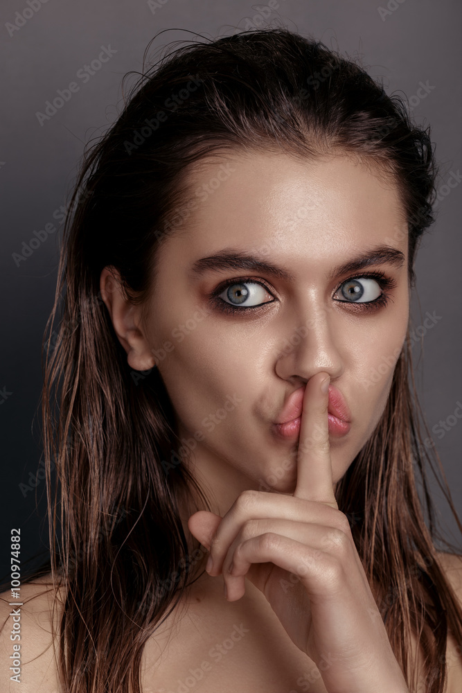 beautiful young woman on a gray background, beauty concept ,fing beautiful young woman on a gray background, beauty concept ,fing