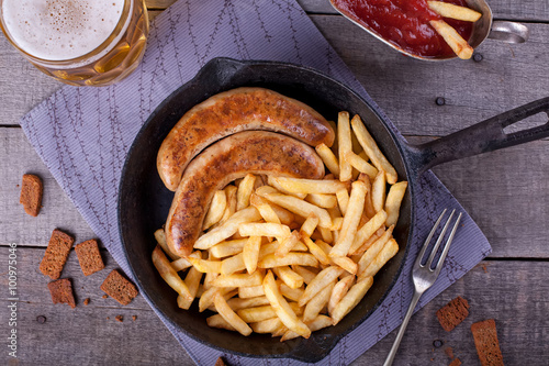 french fries and homemade sausage photo