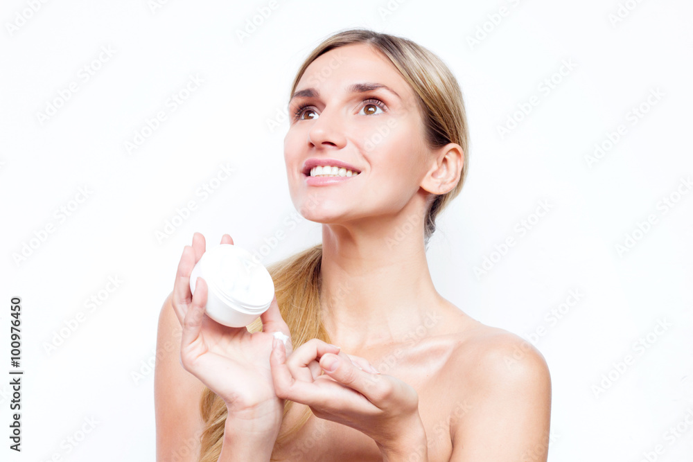 Smiling woman with a jar of face cream. Beauty concept. Smiling woman with a jar of face cream. Beauty concept.