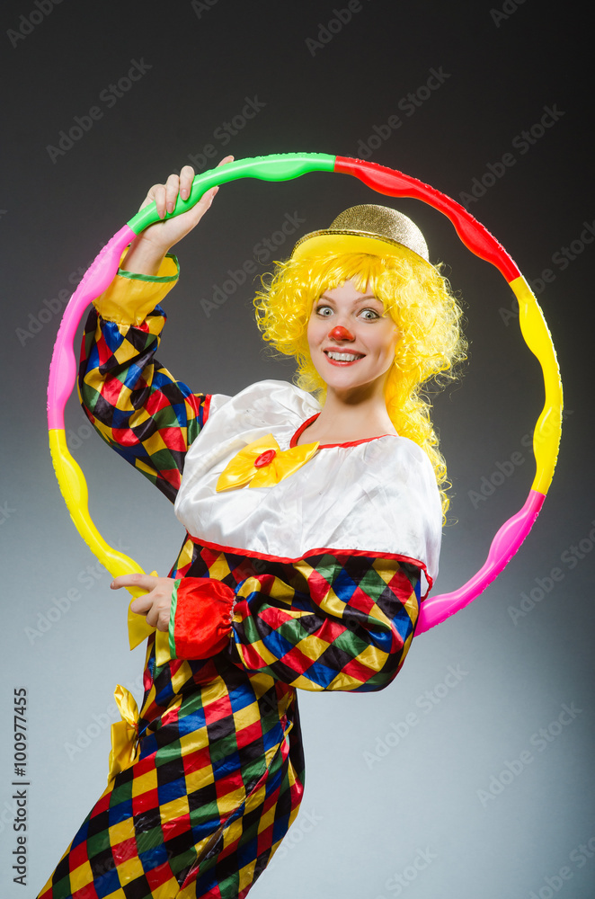 Clown in funny concept on dark background Clown in funny concept on dark background