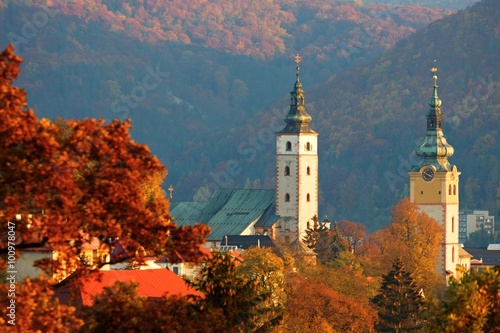 Autumn trees and historical tower buildings in Slovakia