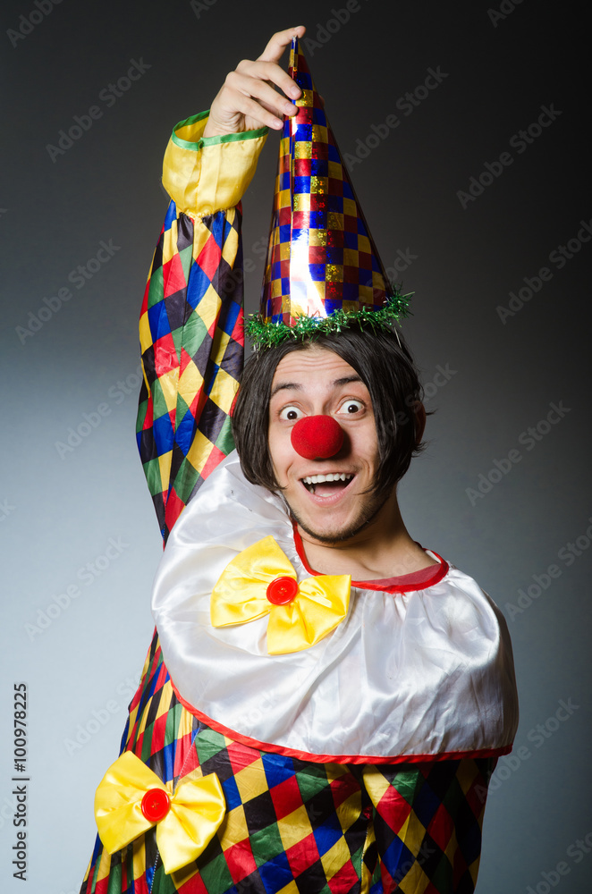 Funny clown against dark background Funny clown against dark background