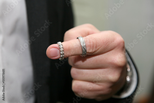 the bride wore two wedding rings on the index finger © photosaint