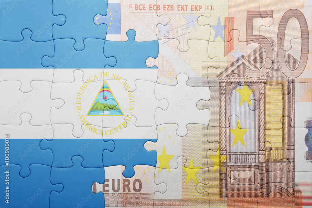 puzzle with the national flag of nicaragua and euro banknote puzzle with the national flag of nicaragua and euro banknote