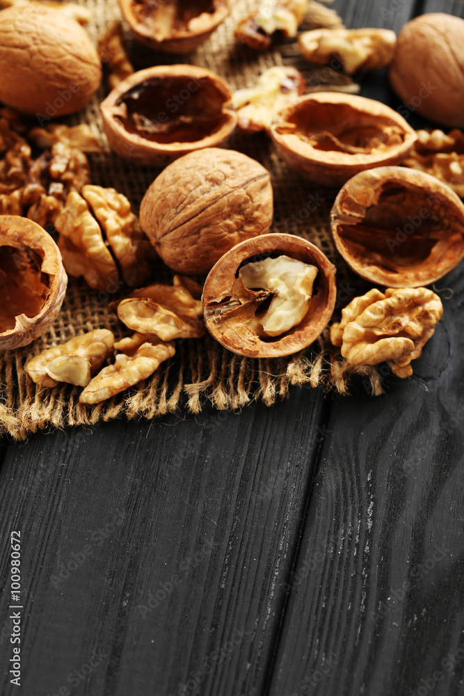 Walnuts on a black wooden table Walnuts on a black wooden table
