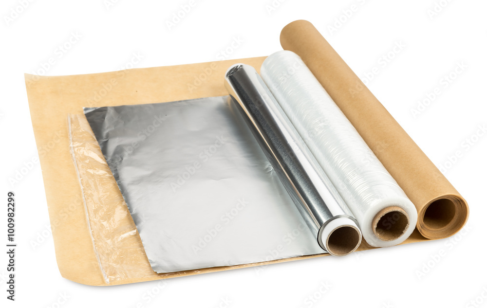 roll of aluminum foil greaseproof paper and cling foil isolated on