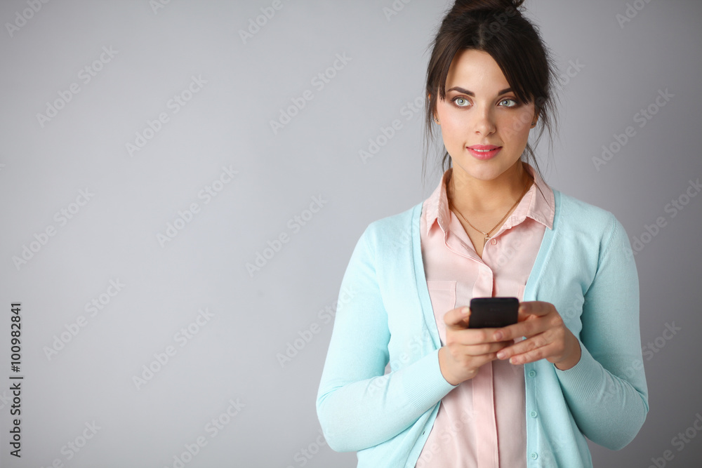 Woman using and reading a smart phone Woman using and reading a smart phone