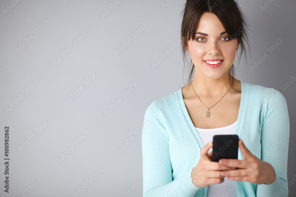 Woman using and reading a smart phone Woman using and reading a smart phone