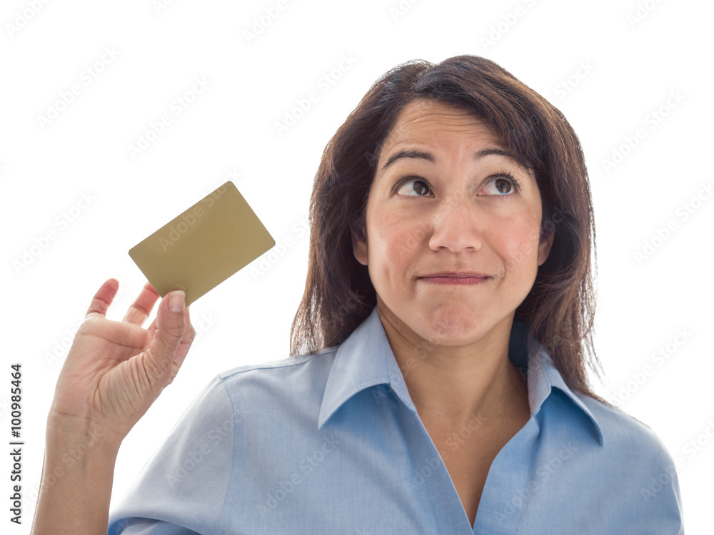 A young mixed race woman is considering what to do with a credit card or gift card. A young mixed race woman is considering what to do with a credit card or gift card.