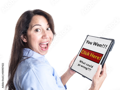 A young woman is overjoyed by message on her tablet computer stating she has won a prize, not realizing it is a scam.