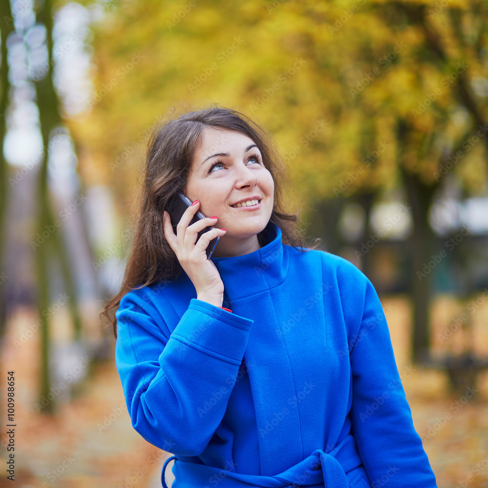 Tourist in Paris, using cell phone Tourist in Paris, using cell phone