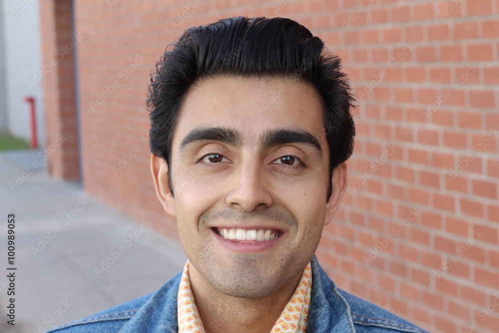 Close up portrait of Arabic nice man on the background of red brick wall. Close up portrait of Arabic nice man on the background of red brick wall.