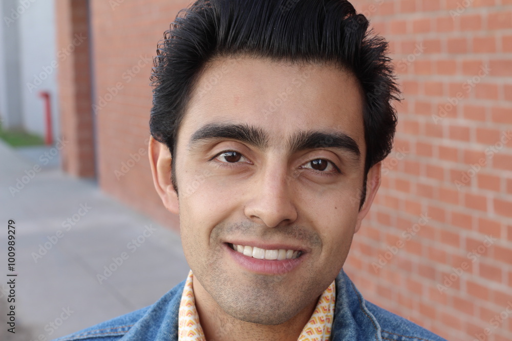 Obraz premium Portrait of a young Hispanic male smiling