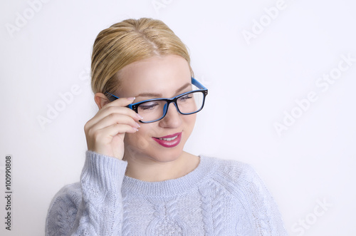 Elegant Caucasian blonde girl with trendy eyeglasses