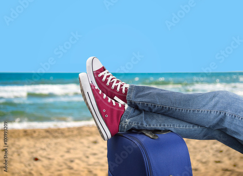 relaxing on the beach with my suitcase