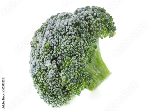 Frozen broccoli with ice crystals on white background
