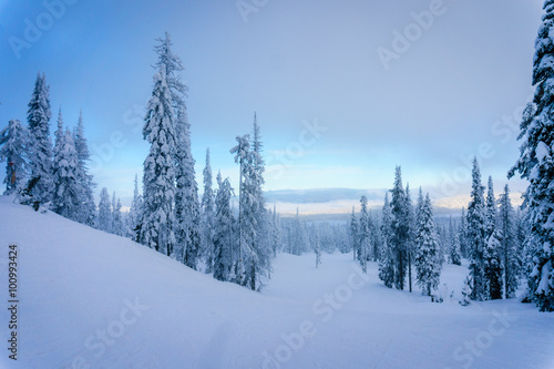 Clouds drifting in over the ski slopes at the village of Sun Peaks on a late afternoon in the Shuswap Highlands of central British Columbia, Canada