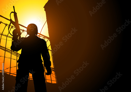 A Guard Holding A Machine Gun