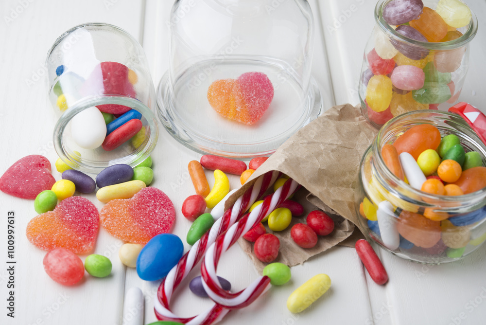 Multicolor candies in glass jars Multicolor candies in glass jars