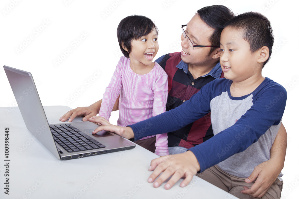 Two kids studying with laptop and their teacher Two kids studying with laptop and their teacher