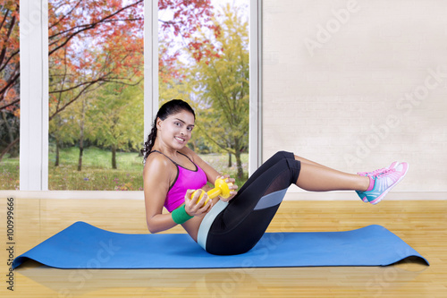Woman workout at home in autumn season