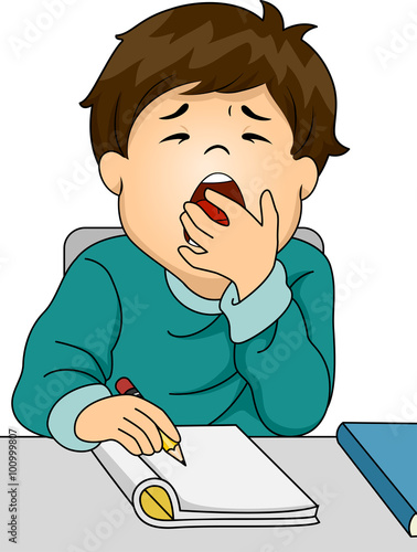 Boy Yawning While Studying
