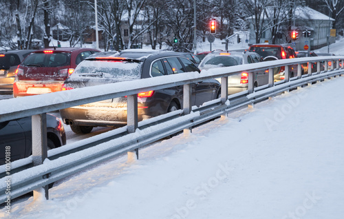 Cars in a traffic jam on winter street