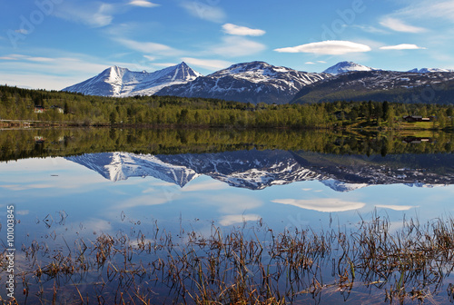 Lake in Norway with snowcapped mountain photo