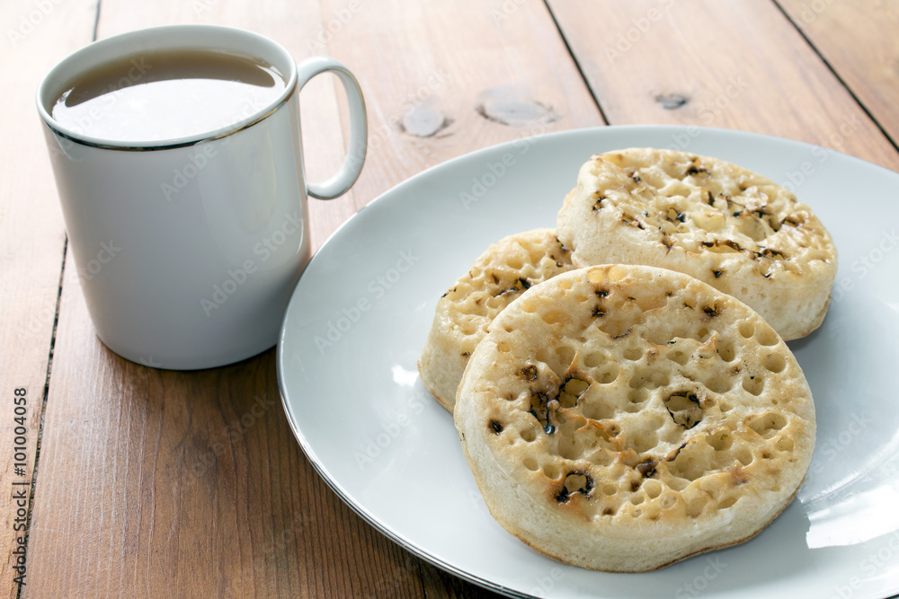 Tea and Crumpets on Wooden Table Tea and Crumpets on Wooden Table