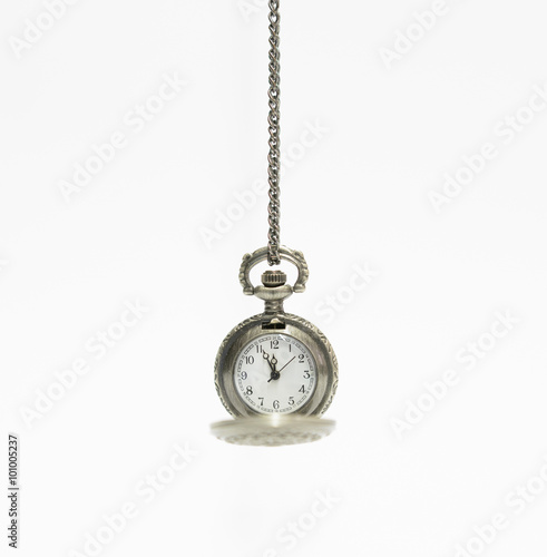 old vintage pocket watch isolated on a white background