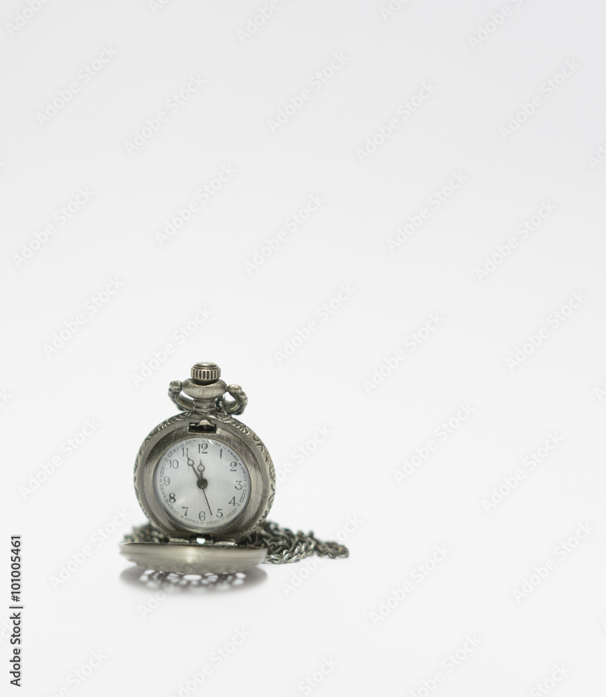 old vintage pocket watch isolated on a white background
