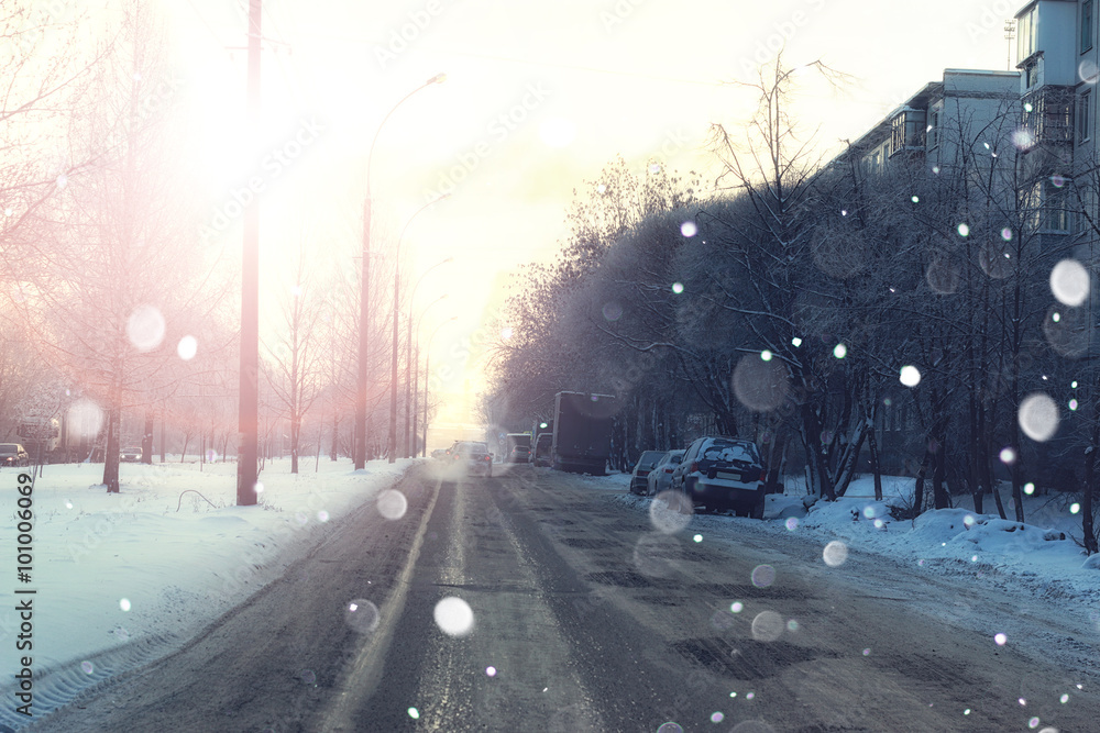 road city with car in winter sunset