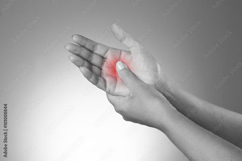 Pain in the joints of the hands. Carpal tunnel syndrome. Pain in the human body on a gray background Pain in the joints of the hands. Carpal tunnel syndrome. Pain in the human body on a gray background