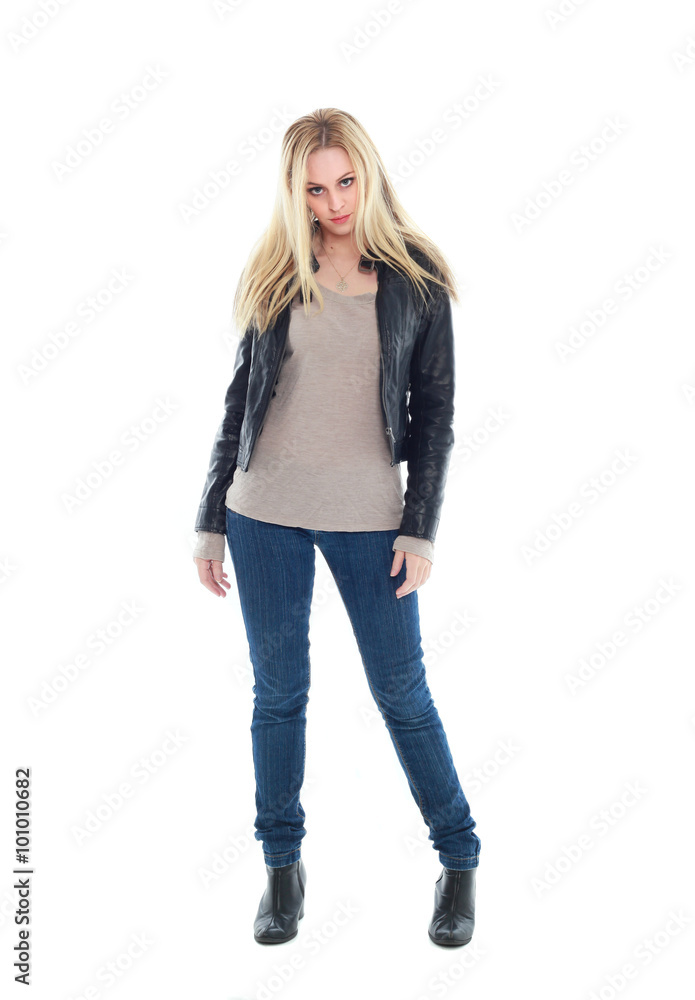 beautiful blonde woman wearing leather jacket and blue jeans, standing pose. isolated on white background. beautiful blonde woman wearing leather jacket and blue jeans, standing pose. isolated on white background.