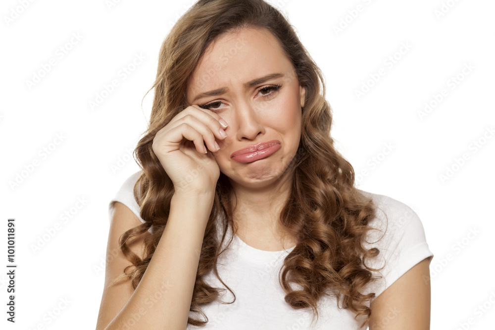 weeping beautiful girl on a white background weeping beautiful girl on a white background