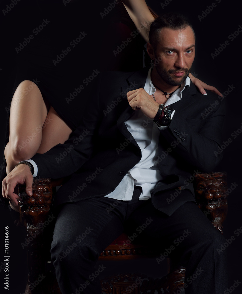 Fotografie Handsome man sitting on the throne