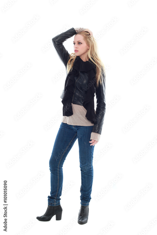 beautiful young woman with long blonde hair wearing black leather jacket and blue jeans. standing pose, isolated on white background. beautiful young woman with long blonde hair wearing black leather jacket and blue jeans. standing pose, isolated on white background.