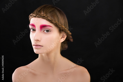 Woman beautiful face with perfect makeup in studio