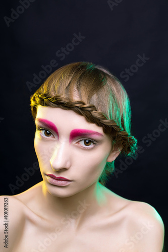 woman with creative make-up. in the studio mixed light yellow and green