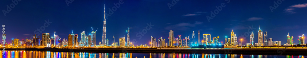 Naklejka premium Night panorama of Dubai Downtown - the UAE