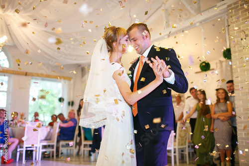 gorgeous stylish happy bride and groom performing their emotiona photo